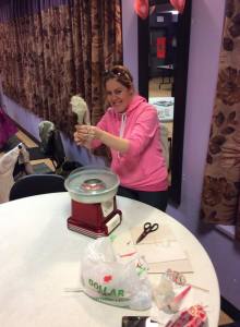 Lyrical Notes' Lorrie Holmes churning sweetness into cotton candy. Creating cotton candy on the premises inspired our participants to help create the paper cones and enjoy delectable cotton candy.